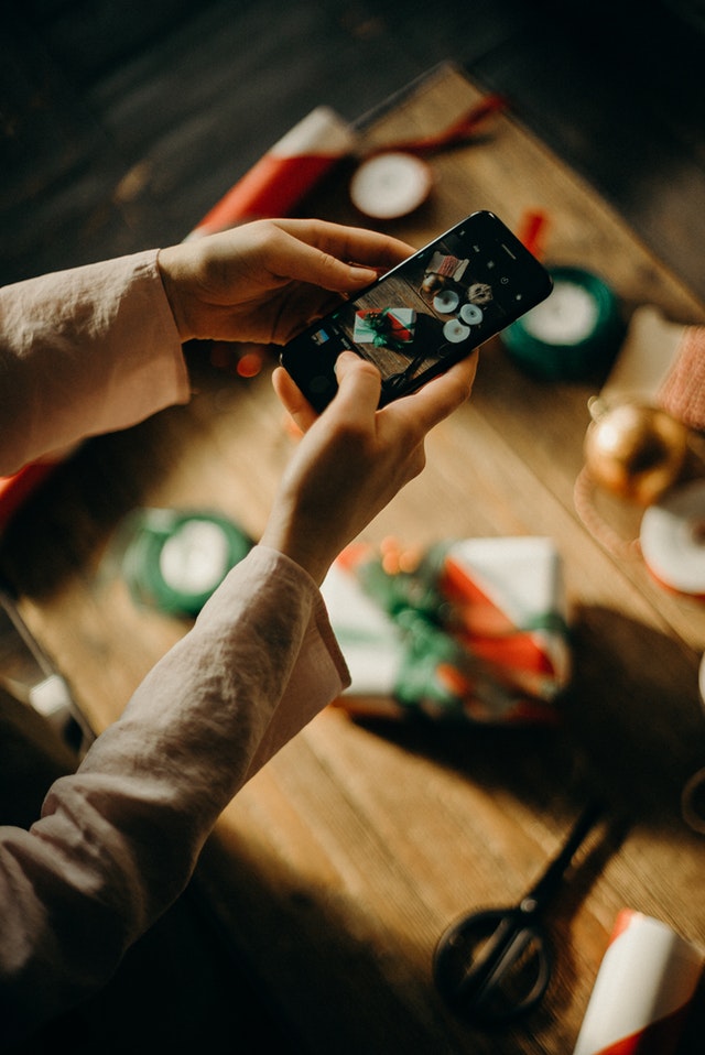 selective focus photography of person taking photo of table 3170951