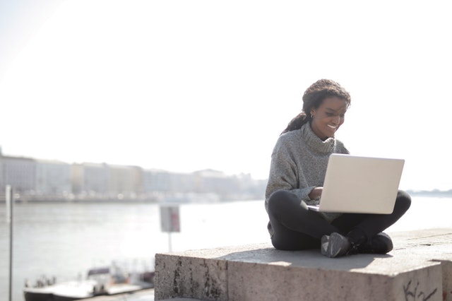woman using laptop outdoors 3907418